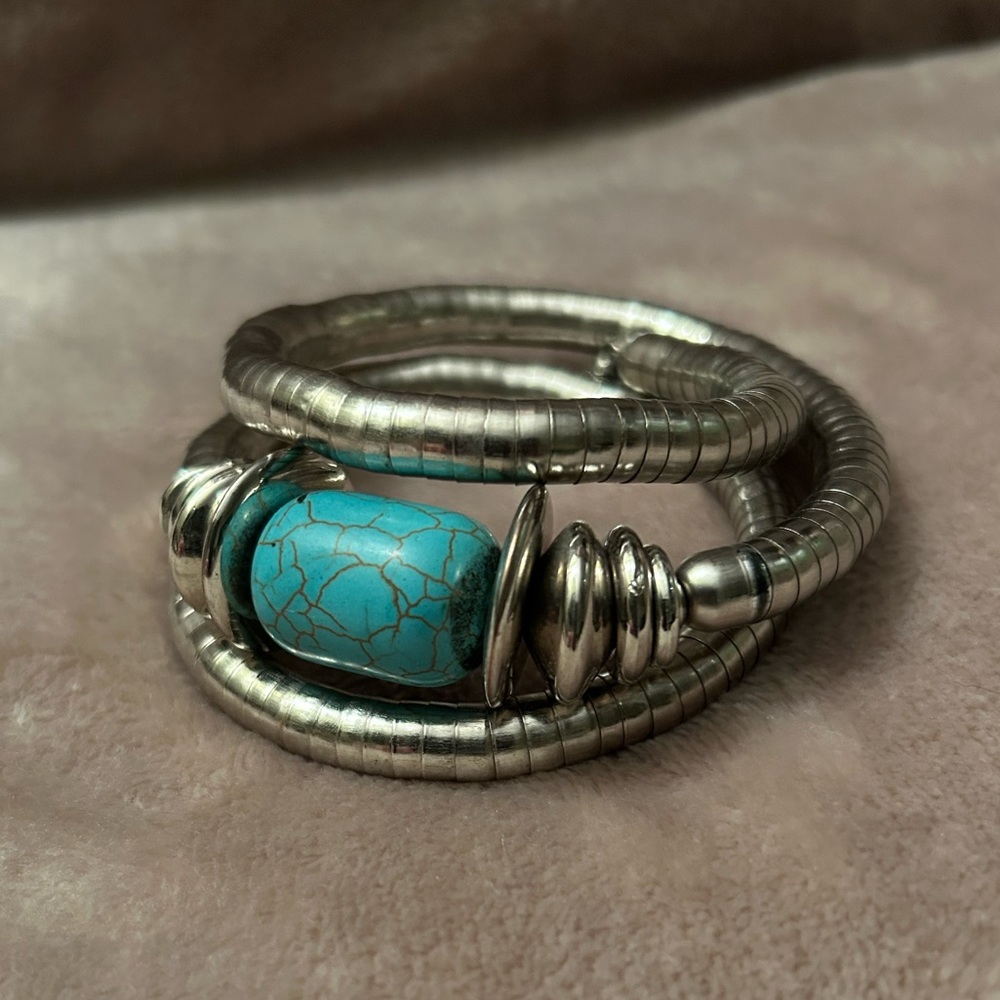 Twisted arm bangle bracelet